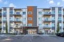 201-360 Harvest Hills Way Ne, Calgary, AB  - Outdoor With Balcony With Facade 