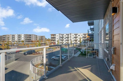 201-360 Harvest Hills Way Ne, Calgary, AB - Outdoor With Balcony With Exterior