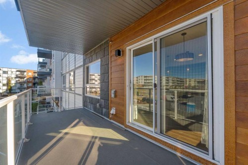 201-360 Harvest Hills Way Ne, Calgary, AB - Outdoor With Balcony With Exterior