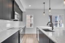 201-360 Harvest Hills Way Ne, Calgary, AB  - Indoor Photo Showing Kitchen With Double Sink With Upgraded Kitchen 