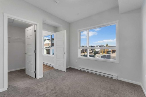 201-360 Harvest Hills Way Ne, Calgary, AB - Indoor Photo Showing Other Room