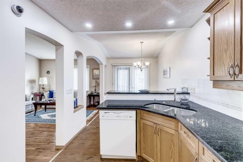 19 Signature Villas Sw, Calgary, AB - Indoor Photo Showing Kitchen With Double Sink