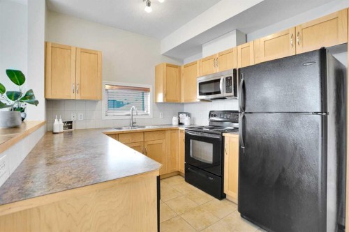 314-5720 2 Street Sw, Calgary, AB - Indoor Photo Showing Kitchen With Double Sink