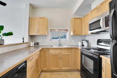 314-5720 2 Street Sw, Calgary, AB - Indoor Photo Showing Kitchen With Double Sink