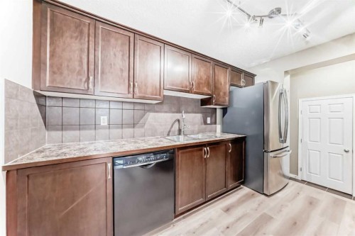3019 Windsong Boulevard Sw, Airdrie, AB - Indoor Photo Showing Kitchen With Double Sink