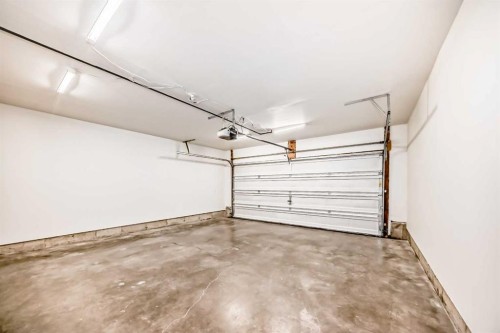 3019 Windsong Boulevard Sw, Airdrie, AB - Indoor Photo Showing Garage