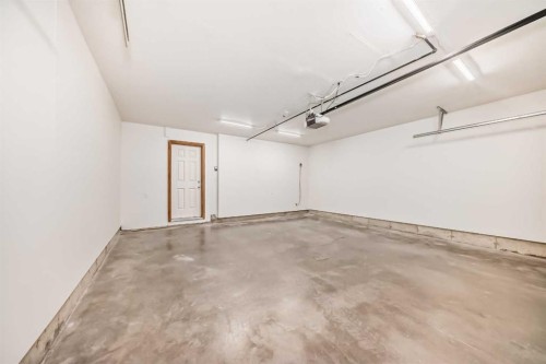 3019 Windsong Boulevard Sw, Airdrie, AB - Indoor Photo Showing Garage