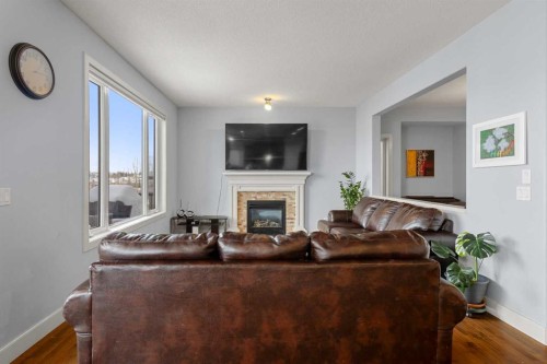 86 Royal Ridge Mount Nw, Calgary, AB - Indoor Photo Showing Living Room With Fireplace