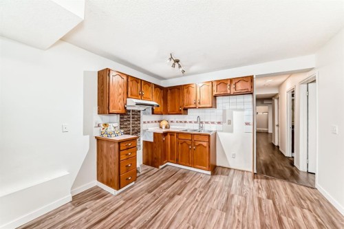 34 Erin Meadow Close Se, Calgary, AB - Indoor Photo Showing Kitchen With Double Sink