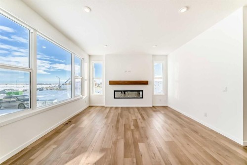 55 Bartlett Row Se, Calgary, AB - Indoor Photo Showing Living Room With Fireplace
