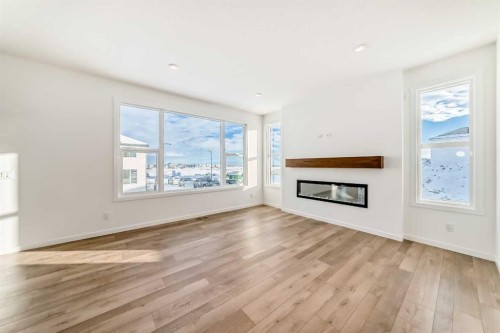 55 Bartlett Row Se, Calgary, AB - Indoor Photo Showing Living Room With Fireplace
