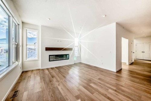 55 Bartlett Row Se, Calgary, AB - Indoor Photo Showing Living Room With Fireplace