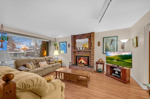 11 Berwick Close Nw, Calgary, AB - Indoor Photo Showing Living Room With Fireplace