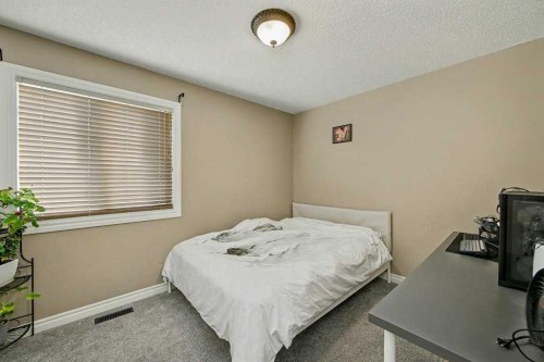 91 Panatella Close Nw, Calgary, AB - Indoor Photo Showing Bedroom