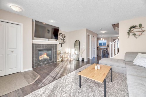 96 Auburn Meadows Boulevard Se, Calgary, AB - Indoor Photo Showing Living Room With Fireplace