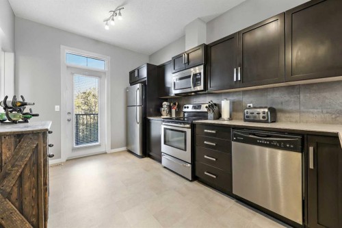 68 New Brighton Point Se, Calgary, AB - Indoor Photo Showing Kitchen With Stainless Steel Kitchen