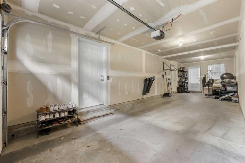 68 New Brighton Point Se, Calgary, AB - Indoor Photo Showing Garage