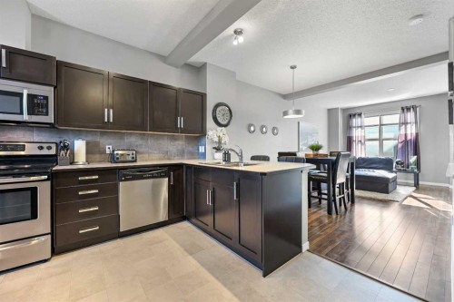 68 New Brighton Point Se, Calgary, AB - Indoor Photo Showing Kitchen With Stainless Steel Kitchen With Upgraded Kitchen