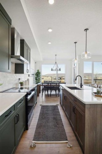 213 Southbow Drive, Cochrane, AB - Indoor Photo Showing Kitchen With Upgraded Kitchen