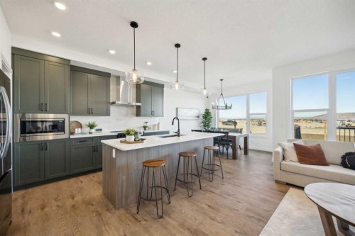 213 Southbow Drive, Cochrane, AB - Indoor Photo Showing Kitchen With Upgraded Kitchen