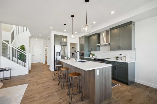 213 Southbow Drive, Cochrane, AB - Indoor Photo Showing Kitchen With Upgraded Kitchen