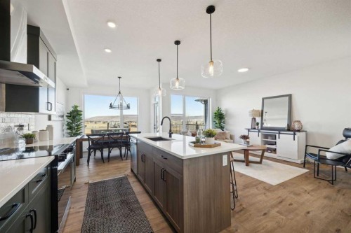 213 Southbow Drive, Cochrane, AB - Indoor Photo Showing Kitchen With Upgraded Kitchen