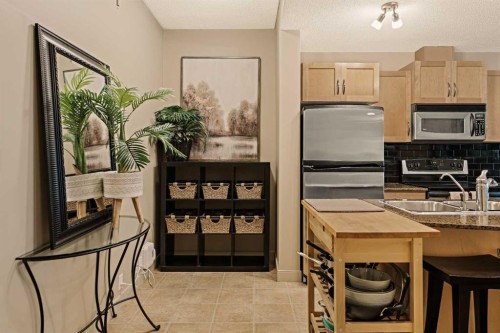 1411-5605 Henwood Street Sw, Calgary, AB - Indoor Photo Showing Kitchen With Stainless Steel Kitchen With Double Sink