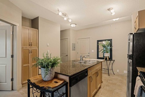 1411-5605 Henwood Street Sw, Calgary, AB - Indoor Photo Showing Kitchen With Double Sink