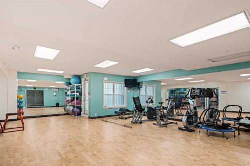 1411-5605 Henwood Street Sw, Calgary, AB - Indoor Photo Showing Gym Room