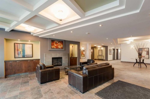 1411-5605 Henwood Street Sw, Calgary, AB - Indoor With Fireplace