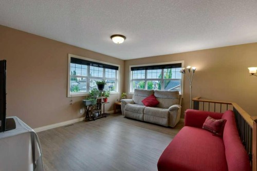 200 Cimarron Drive, Okotoks, AB - Indoor Photo Showing Living Room