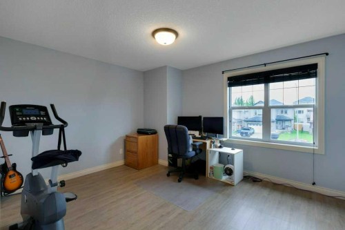 200 Cimarron Drive, Okotoks, AB - Indoor Photo Showing Gym Room