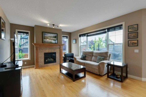 200 Cimarron Drive, Okotoks, AB - Indoor Photo Showing Living Room With Fireplace