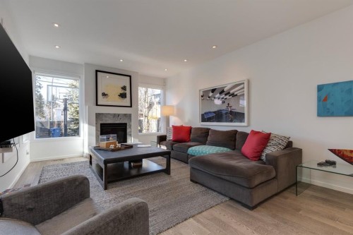 329 11 Street Nw, Calgary, AB - Indoor Photo Showing Living Room With Fireplace