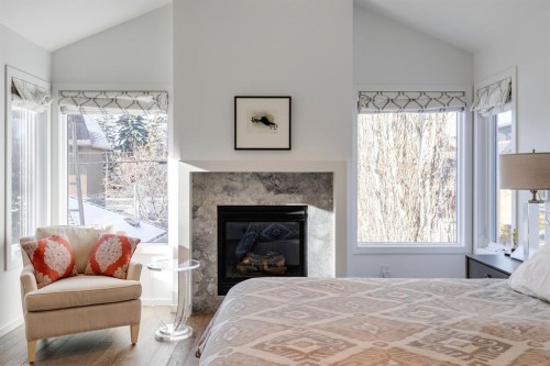 329 11 Street Nw, Calgary, AB - Indoor Photo Showing Bedroom With Fireplace