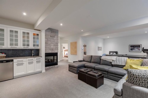 329 11 Street Nw, Calgary, AB - Indoor Photo Showing Living Room With Fireplace
