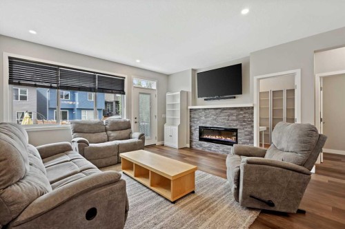 41 Seton Grove Se, Calgary, AB - Indoor Photo Showing Living Room With Fireplace
