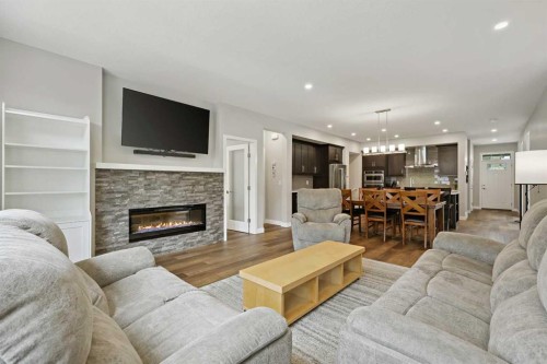 41 Seton Grove Se, Calgary, AB - Indoor Photo Showing Living Room With Fireplace