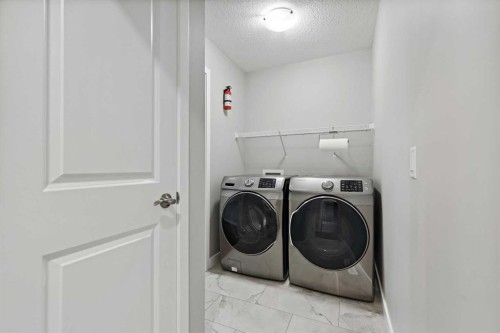 41 Seton Grove Se, Calgary, AB - Indoor Photo Showing Laundry Room