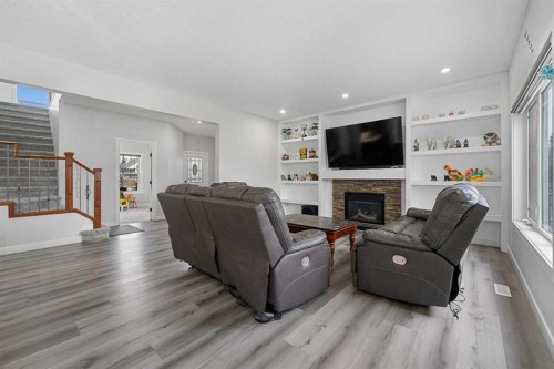 280 Windermere Drive, Chestermere, AB - Indoor Photo Showing Living Room With Fireplace