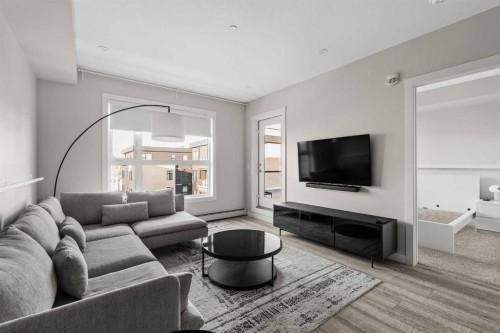 308-4160 Norford Avenue Nw, Calgary, AB - Indoor Photo Showing Living Room