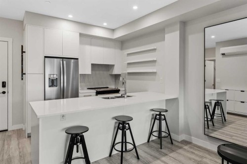 308-4160 Norford Avenue Nw, Calgary, AB - Indoor Photo Showing Kitchen With Upgraded Kitchen