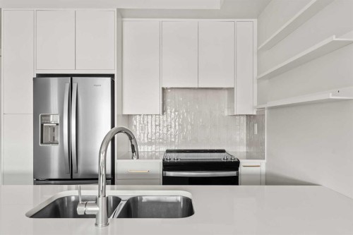308-4160 Norford Avenue Nw, Calgary, AB - Indoor Photo Showing Kitchen With Double Sink With Upgraded Kitchen