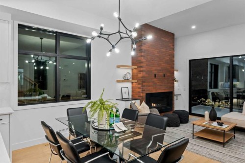 3112 13 Avenue Sw, Calgary, AB - Indoor Photo Showing Dining Room With Fireplace