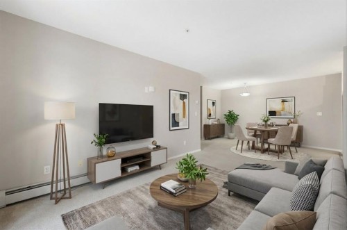 1102-2395 Eversyde Avenue Sw, Calgary, AB - Indoor Photo Showing Living Room