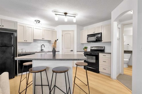 101-120 Panatella Landing Nw, Calgary, AB - Indoor Photo Showing Kitchen With Upgraded Kitchen