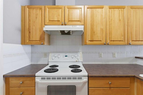 1302-1010 Arbour Lake Road Nw, Calgary, AB - Indoor Photo Showing Kitchen