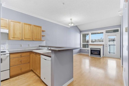 1302-1010 Arbour Lake Road Nw, Calgary, AB - Indoor Photo Showing Kitchen