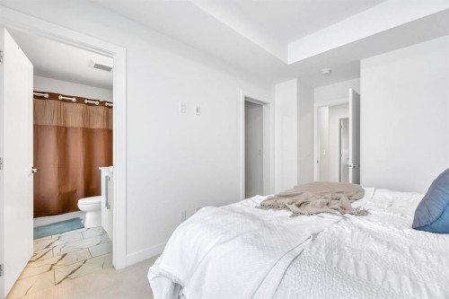 220 Creekstone Drive Sw, Calgary, AB - Indoor Photo Showing Bedroom