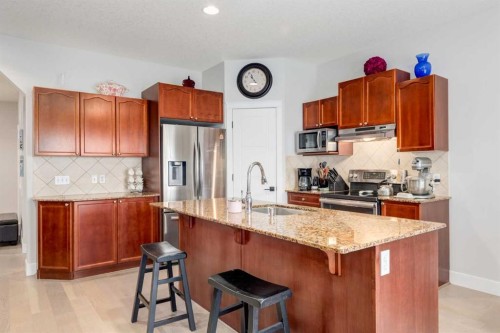 163 Cougarstone Court Sw, Calgary, AB - Indoor Photo Showing Kitchen With Stainless Steel Kitchen